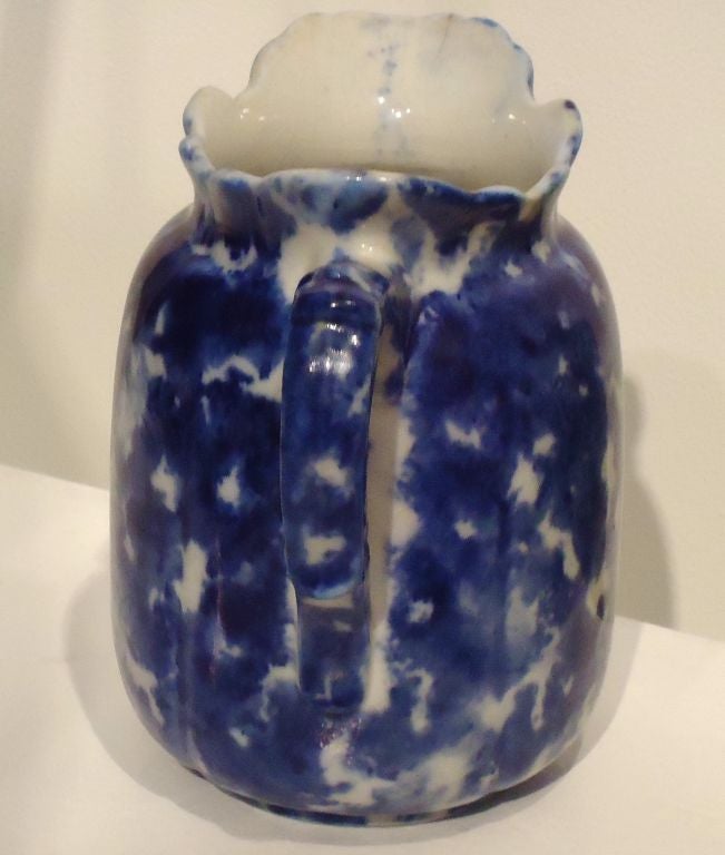 WONDERFUL 19THC SPONGEWARE MILK PITCHER IN GREAT CONDITION AND UNUSUAL FORM.THE DEEP BLUE GLAZE IS THE BEST.THE HANDLE HAS A FORMED PATTERN.