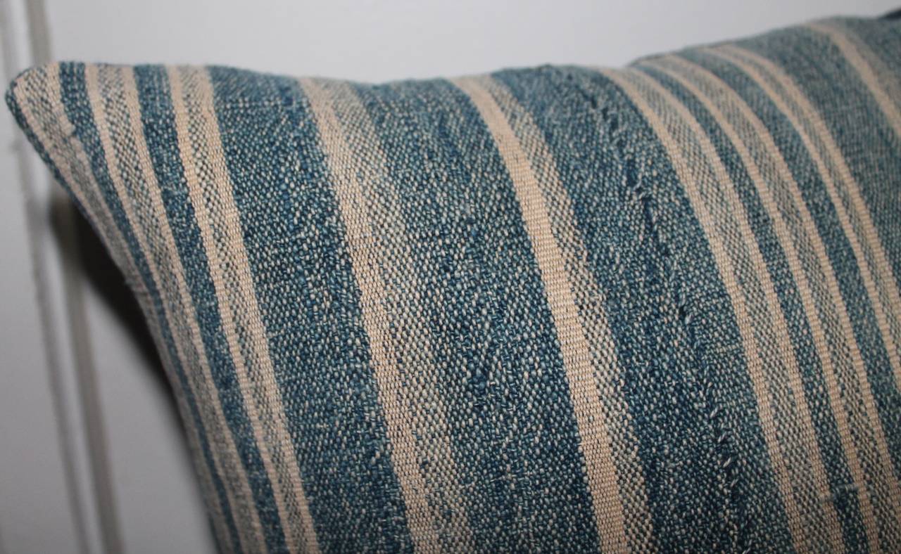 This wonderful worn and faded linen cotton ticking is amazing and has blue cotton linen backing. This early textile is from Europe. They are hand-sewn and pieced together.