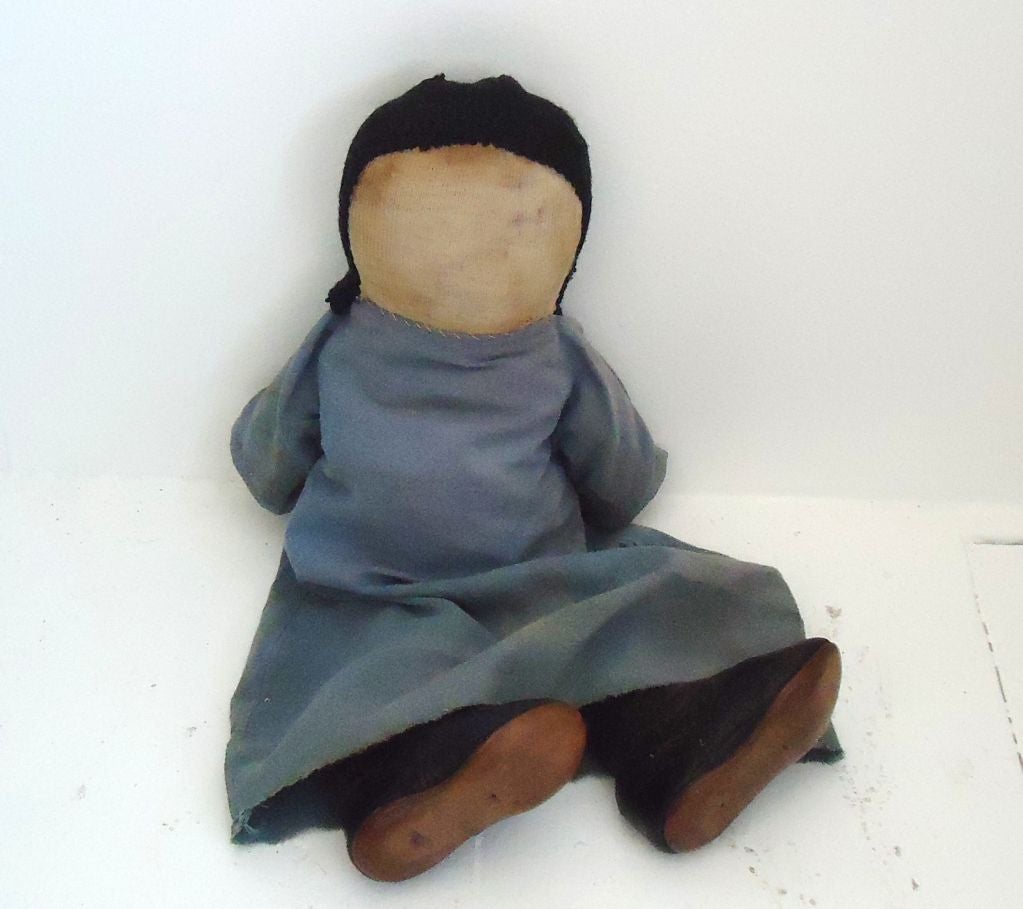 1930s Amish doll with 19th century leather booties and hand sown clothing. Originally from Lancaster County, Pennsylvania.
