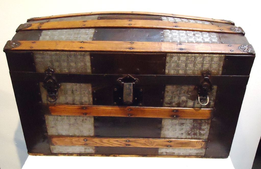 FANTASTIC  19THC CAMEL BACK BUGGY OR CARRIAGE TRUNK WITH THE ORIGINAL WALL PAPER INTERIOR LINING.THIS TRUNK IS IN ATTIC SURFACE WITH LEATHER HANDLES ON THE SIDES FOR MOVING PLACE TO PLACE.WONDERFUL ORIGINAL WOOD TRIM. FANTASTIC CONDITION.