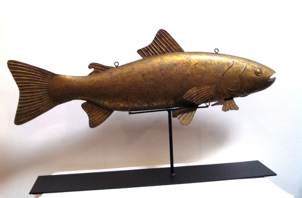 FOLKY 19THC ORIGINAL SURFACE GILDED HOLLOW BODY TIN FISH/COD TRADE SIGN .THIS FANTASTIC & UNUSUAL FORM HANGING TRADE SIGN HAS THE ORIGINAL EYE HOOKS FOR HANGING. WE OF COURSE HAD A CUSTOM MADE IRON STAND MADE FOR DISPLAY OF THE COD.THIS SIGN