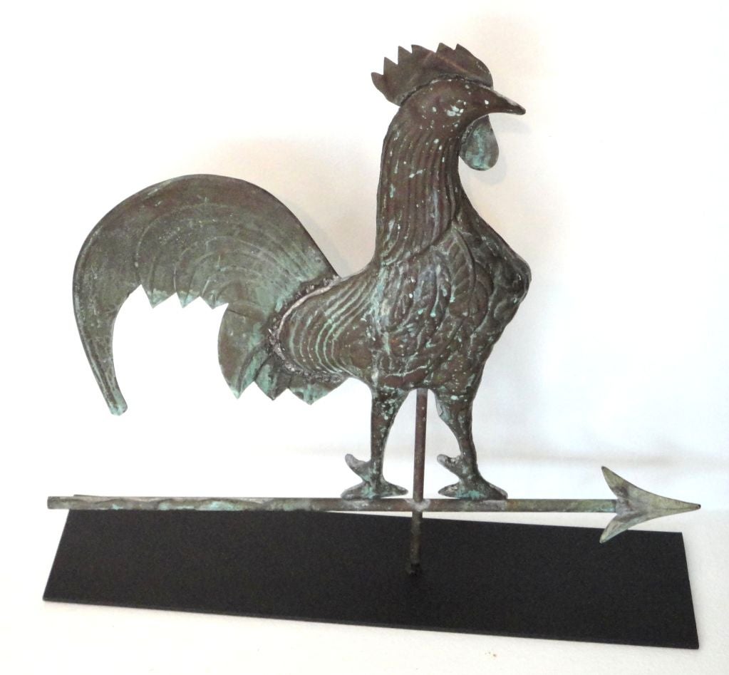 LATE 19THC WONDERFUL FOLKY ROOSTER WEATHERVANE. GREAT PATINA AND FORM.THE CONDITION IS VERY GOOD MINOR DINGS IN THE COMB ABOVE THE HEAD AND TAIL FEATHERS MESSING,PROBABLY SHOT OFF OR FELL OFF OVER THE YEARS.THE SURFACE IS GREAT AND NO BULLET HOLES