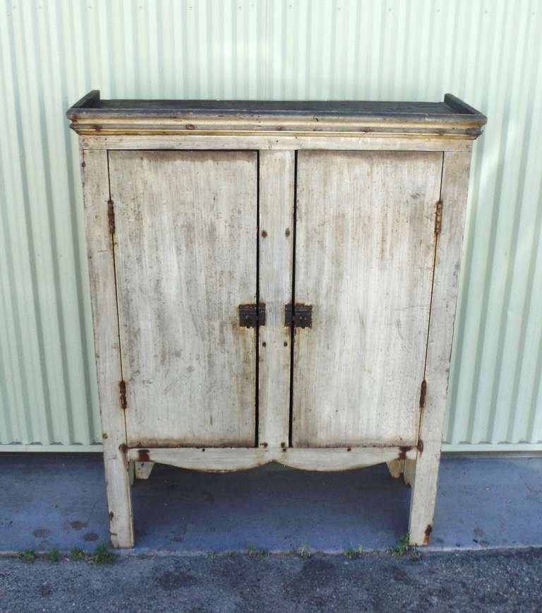 This interesting form and surface 19thc jelly cupboard was found in Central Pennsylvania .The most unusual scalloped skirt base and cut out legs on both sides.The surface is worn and a real mellow patina. The inside of the cupboard is a dark natural