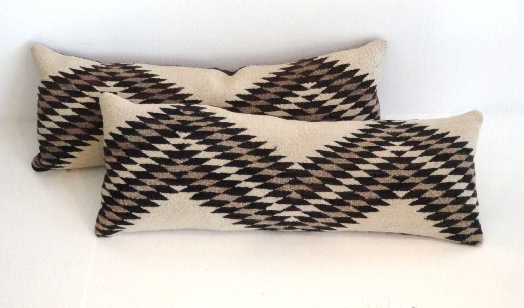 FANTASTIC PAIR OF NAVAJO EYE DAZZLER BOLSTER PILLOWS.HAND WOVEN AUTHENTIC INDIAN WEAVING WITH COOL BROWN LINEN BACKING.SOLD AS A PAIR FOR 950. AND THEY ARE IN MINT CONDITION.