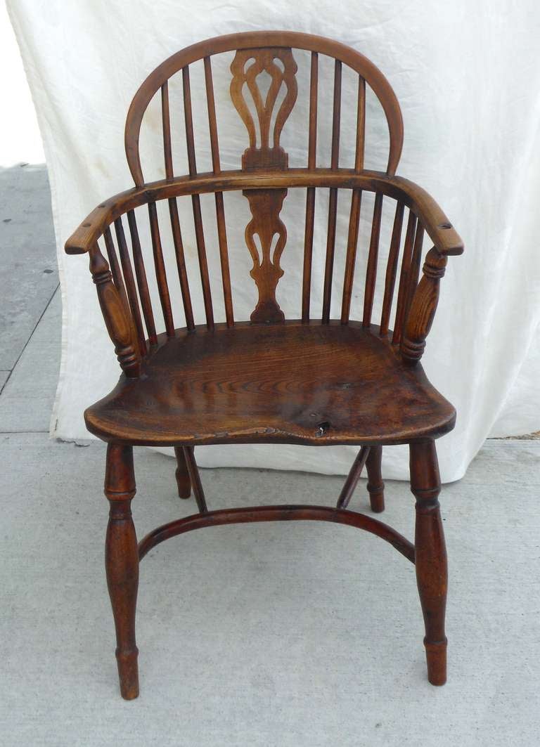Amazing 18thc hickory & pine early worn extended arm plank seat Windsor chair. This patina is the best with a wear hole / knot in the end of the seat. This chair is in great condition and very comfortable . The best surface ever !