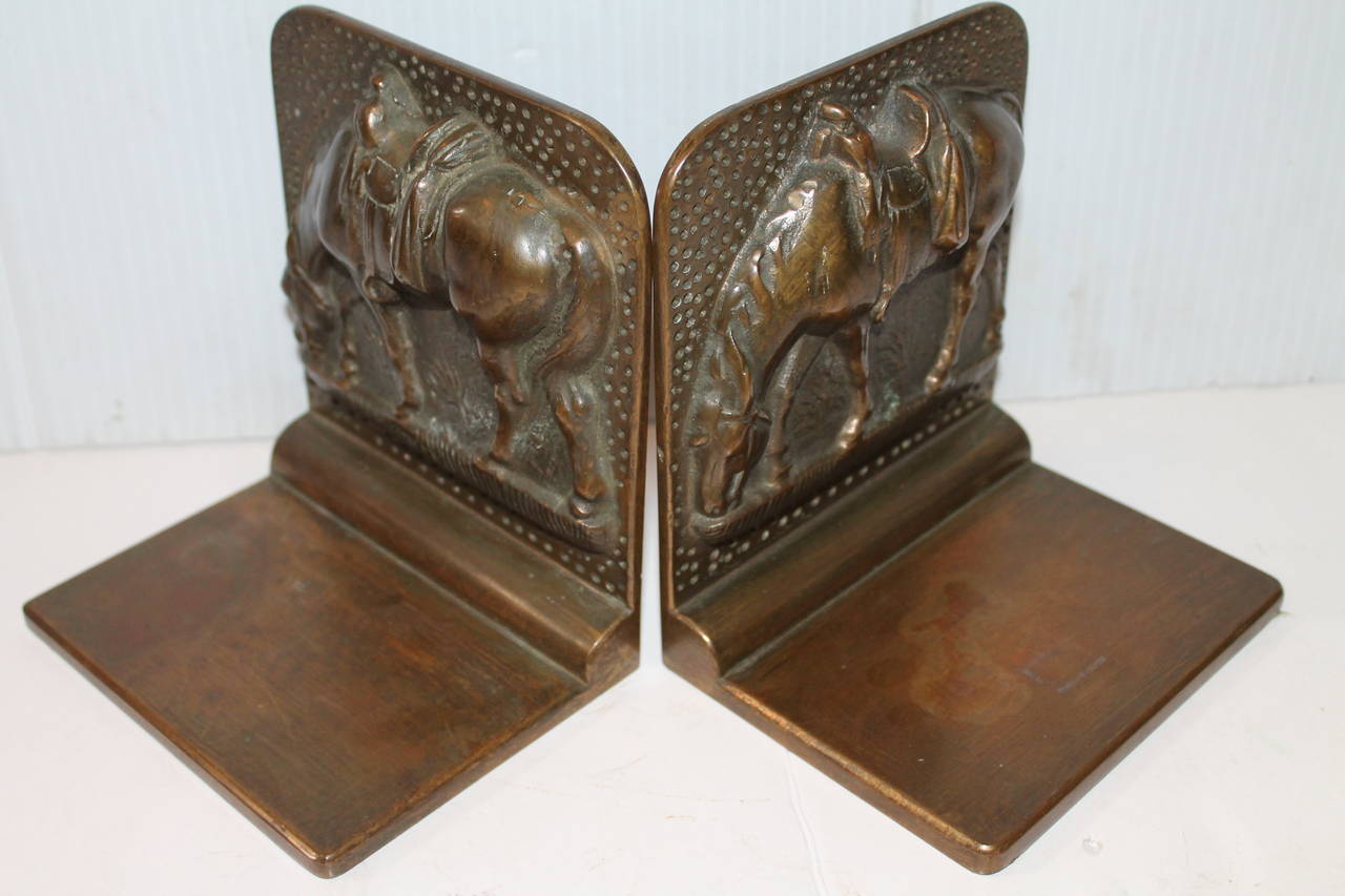 This pair of heavy and solid bronze bookends are very large and in great as found condition. They are unsigned and in great as found condition. Fantastic on a ranch or in a book collection.