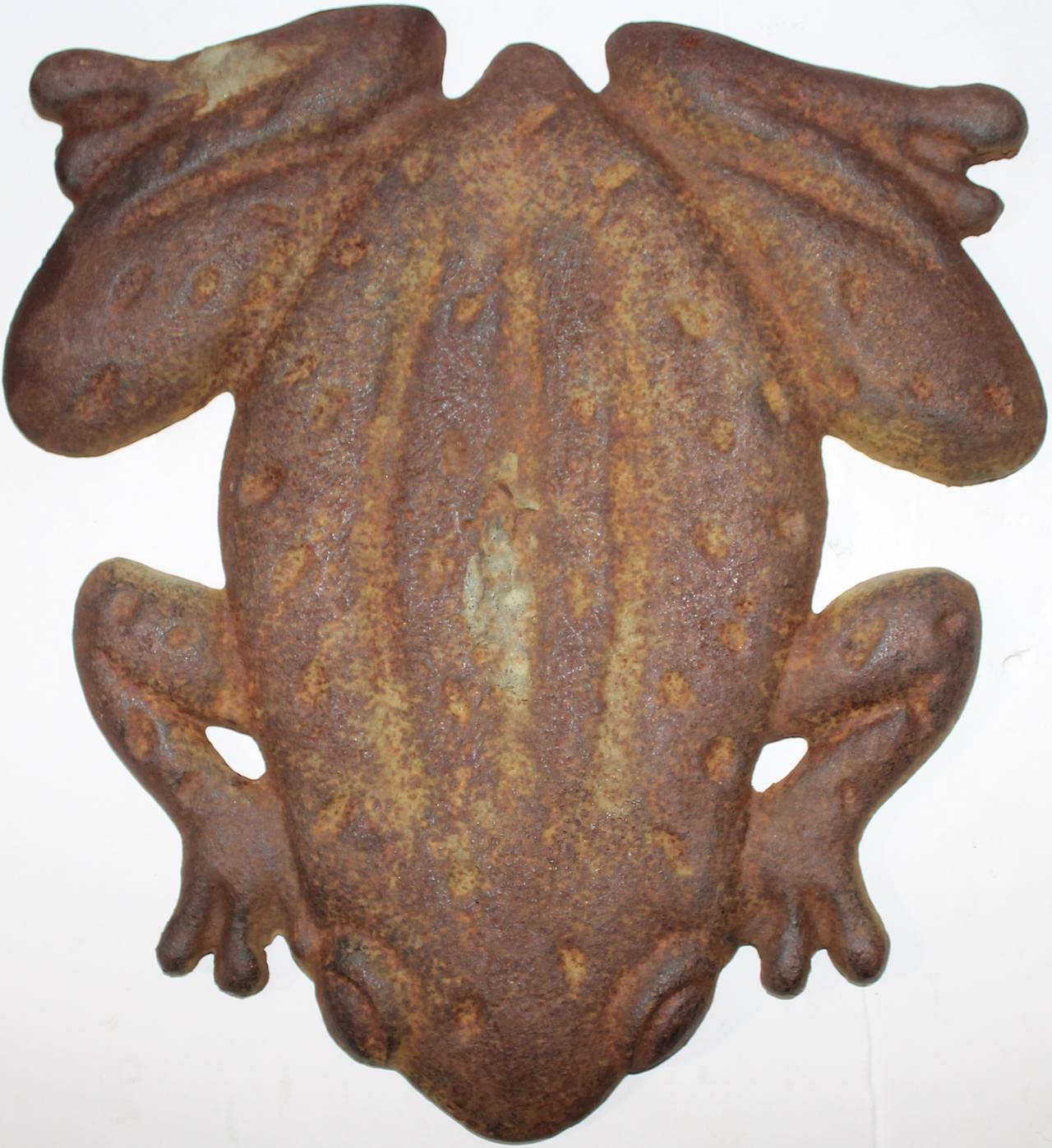 This fun large flat original worn green painted cast iron frog is in good condition with oxidation and rust surface. It is most unusual.