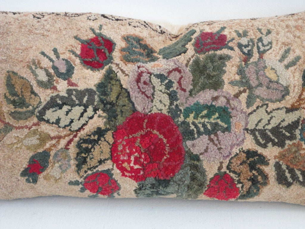 THIS WONDERFUL WOOL FLORAL HAND HOOKED RUG HAS BEEN TURNED IN TO THE MOST FANTASTIC BOLSTER PILLOW.THIS RUG WAS FOUND IN THE STATE OF MAINE.THE BACKING OF THE PILLOW IS 19THC HOMESPUN LINEN.THE INSERT IS DOWN & FEATHER FILLED.THE CONDITION IS VERY
