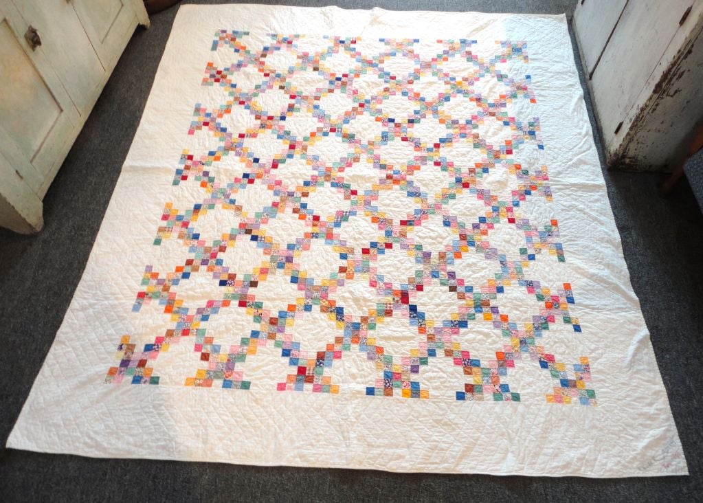 Fantastic signed Laura R. Morris 1941 from Ohio mini postage stamp double chain quilt. The quilt is in great condition and has wonderful piece work. This is a full size quilt.
