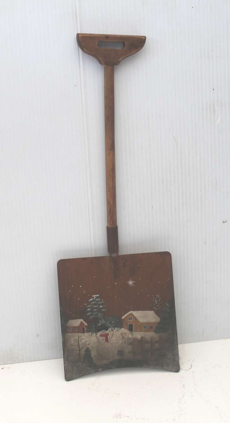 This wonderful original painted snow scene shovel has a metal blade with the original wood handle. Great just in time for the holiday season. Wonderful wall ornament. Fantastic patina and all original paint.