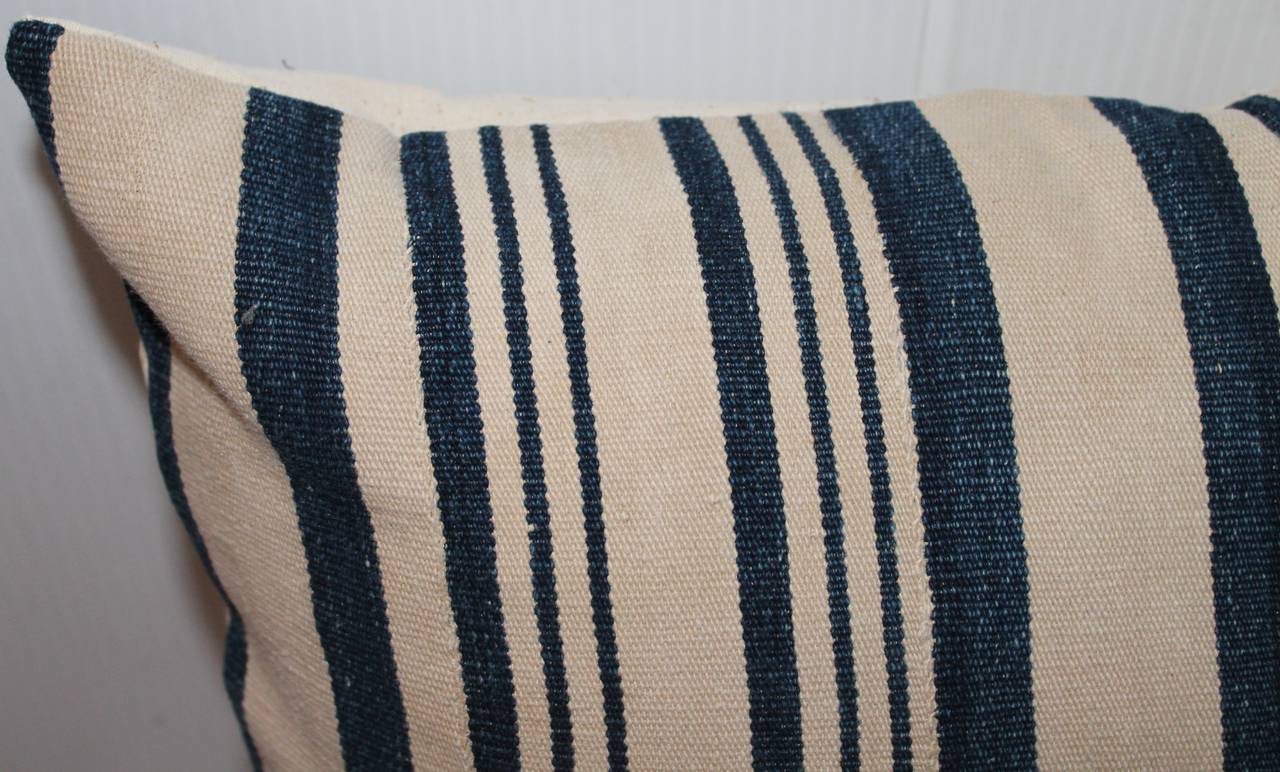 This interesting pair of early 19th century blue and white ticking pillows are in fantastic condition with a rich, deep indigo color. The backings are in cotton linen.