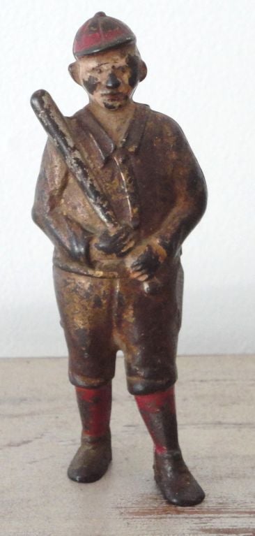 WONDERFUL PAINTED IRON BASEBALL PLAYER PENNY BANK FROM A COLLECTION OF FOLK ART AND TOYS.THIS BANK HAS ALL THE ORIGINAL GILDING AND PAINT AS FOUND.THE CONDITION IS GOOD.