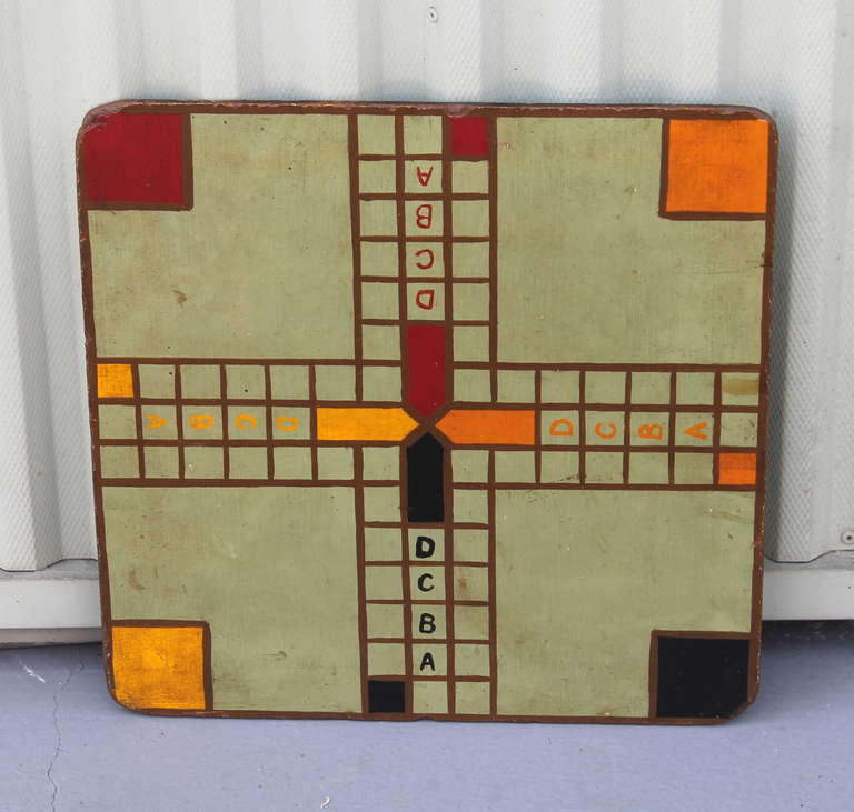 Early 1930s original painted  game board. This foly game has ABCD on each side going down the center of the board on each side. The colors are fantastic with a lime green ground. The condition is very good  with wear consistent with age.