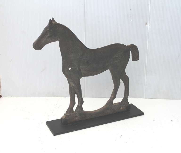 This is a fantastic example of great folk art ! This cast iron horse windmill weight is on a custom made cast iron stand. The form and surface are the very best. The condition is very good. Great patina !