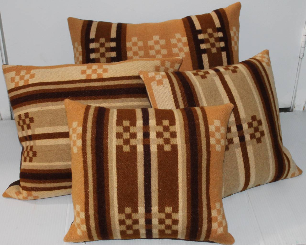 These pillows were made from a 19Thc horse blanket and all have brown cotton linen backings. The inserts are down and feather fill. The sizes are alł slightly different. Sold as one group.