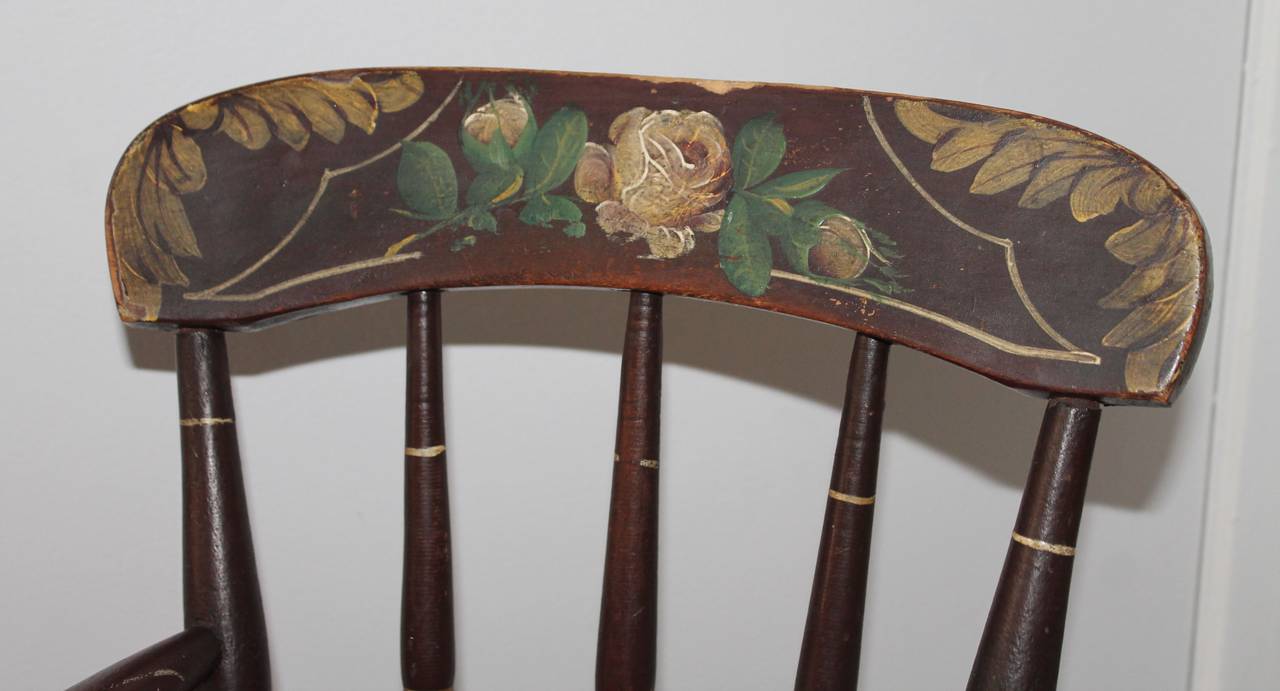 19th century original paint decorated child rocking chair. This rocking chair is originally from York County Pennsylvania found in a private collection in California. This item is all original and hand-painted.