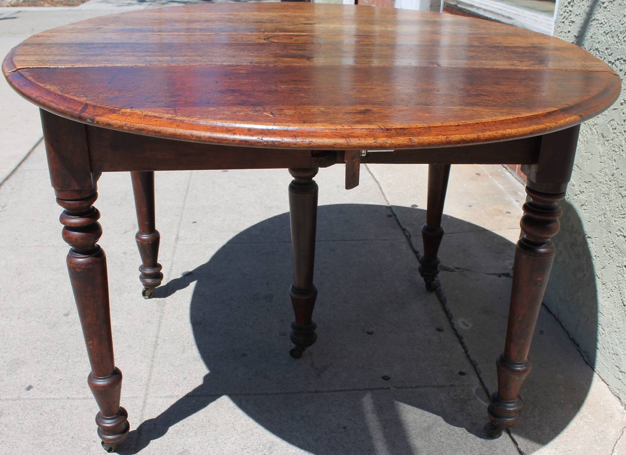 American Early 19th Century Round Rustic Drop-Leaf Table