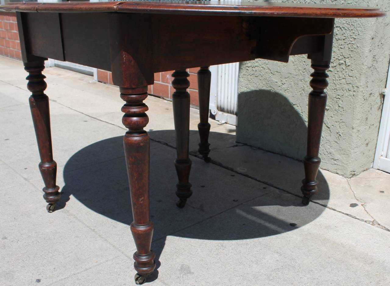 Patinated Early 19th Century Round Rustic Drop-Leaf Table