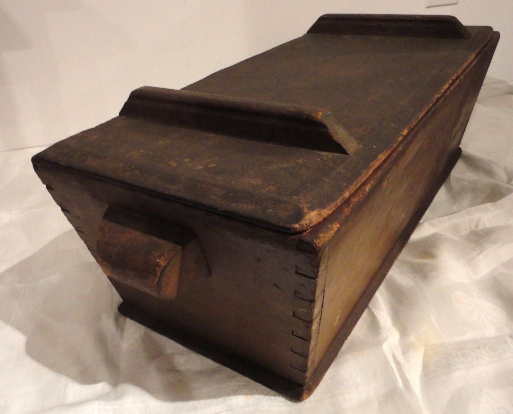 19th century original brown painted dovetailed dough tray with lid from Lewis-burg, PA. The wonderful large rounded handles are most unusual on this dough tray. The box is all square nails construction and dovetailed throughout. The condition is