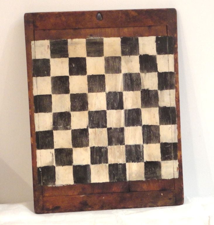 THIS FOLKY HANDMADE ORIGINAL PAINTED GAMEBOARD WAS MADE AND CONSTRUCTED ON A OLD CUTTING BOARD OR DOUGH BOARD FROM PENNSYLVANIA.THE SURFACE IS WONDERFUL AND CONDITION IS GOOD.THIS BLACK AND WHITE BOARD IS IN A FANTASTIC OLD PATINA.