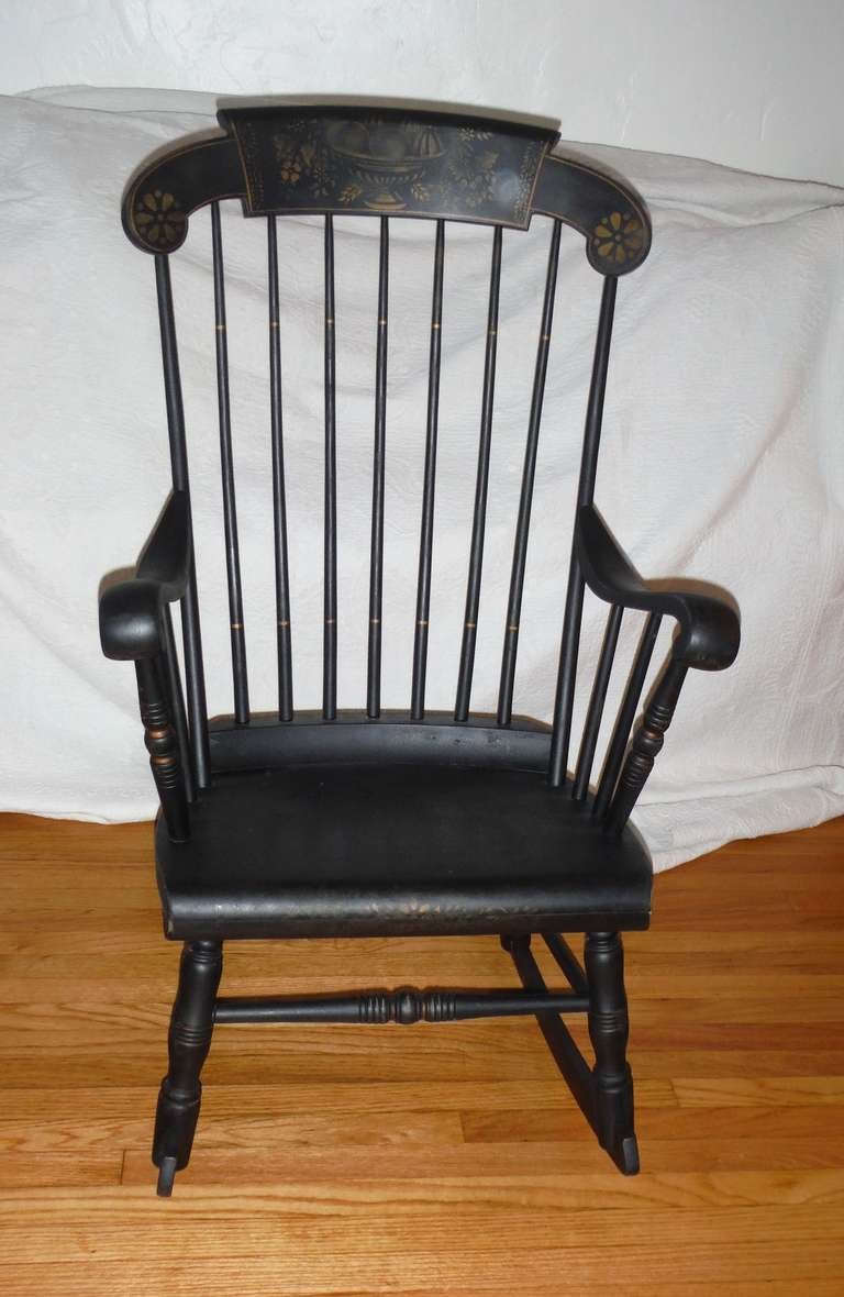 black rocking chair with gold stencil