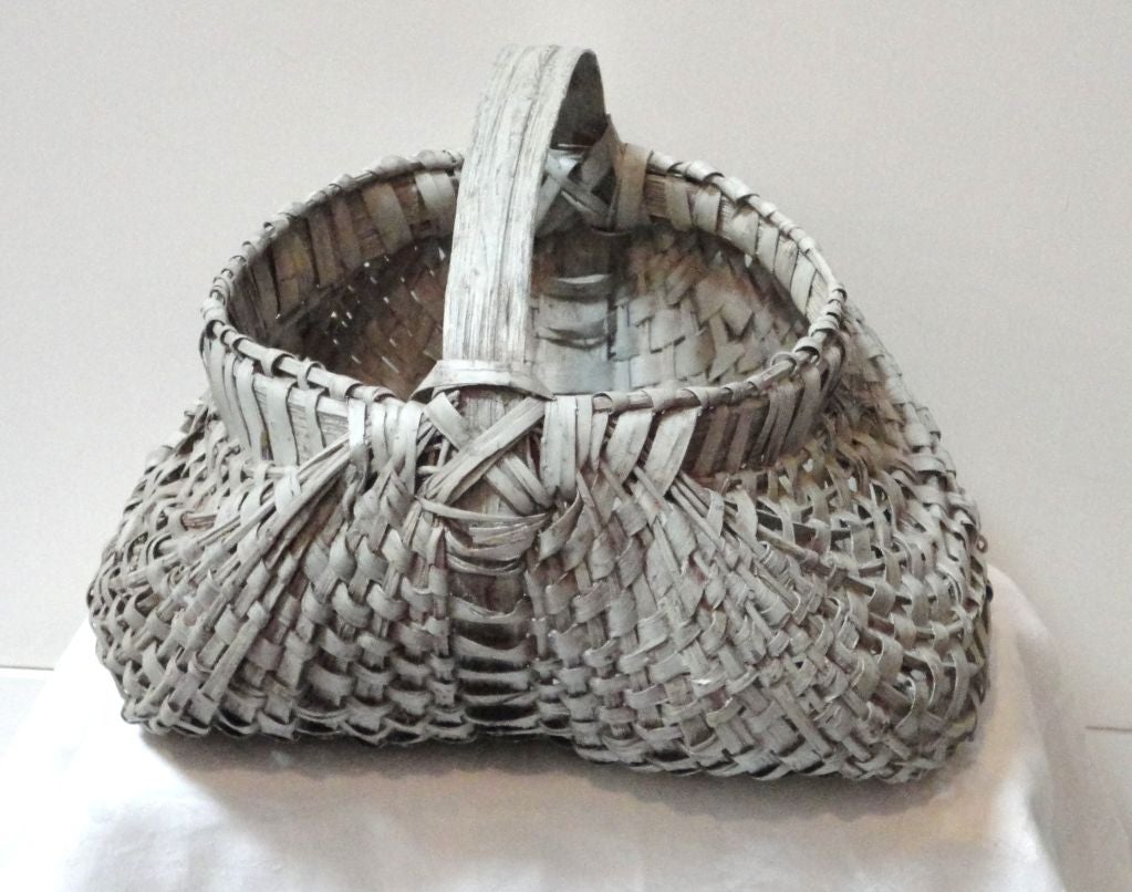 Fantastic form and wonderful light shade of grey paint on this funky buttocks basket. It is in great condition with minor little breaks to be expected with age.