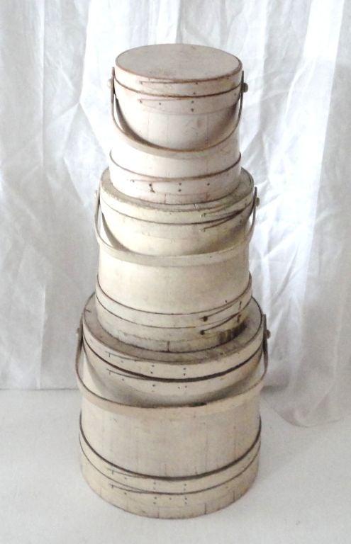 FANTASTIC ORIGINAL WHITE/CREAM PAINTED 19THC FIRKIN /BUCKETS FROM NEW ENGLAND IN WONDERFUL OLD SURFACE.SOLD AS A GROUP OF THREE OR INDIVIDUALLY.SMALL 10 HIGH/10 DIAMETER/10 LONG 895.MED.12 HIGH/12 WIDE/12 LONG 895. LARGE 14 1/2 HIGH 14 1/2 DIAMETER