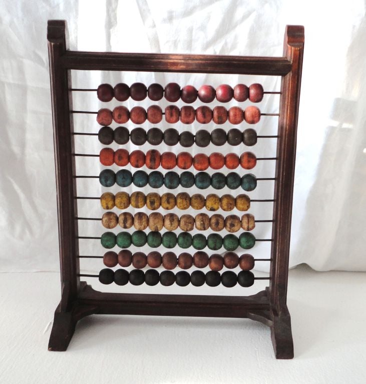 19thc original painted multi colored table top abacus from Pennsylvania.This fun and colorful game has a walnut frame and multi-colored balls.The condition is very good.