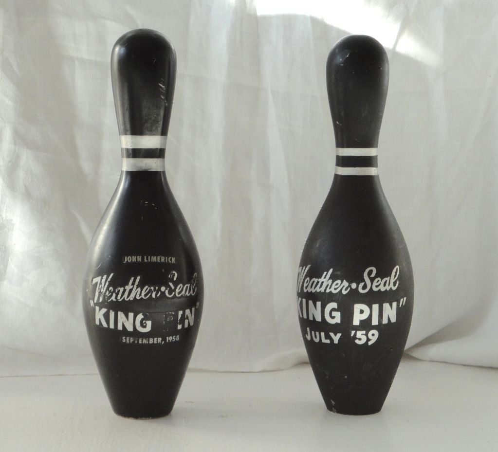 Pair of 1950's bowling pins signed and dated.Original black painted with silver lettering and striping.Sold as a pair.