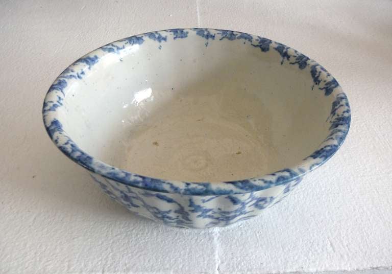 This lovely 19th century Spongeware bowl is in excellent condition. Ten inches wide, the cobalt decoration is applied to fluted white stoneware crockery with a turned rim.