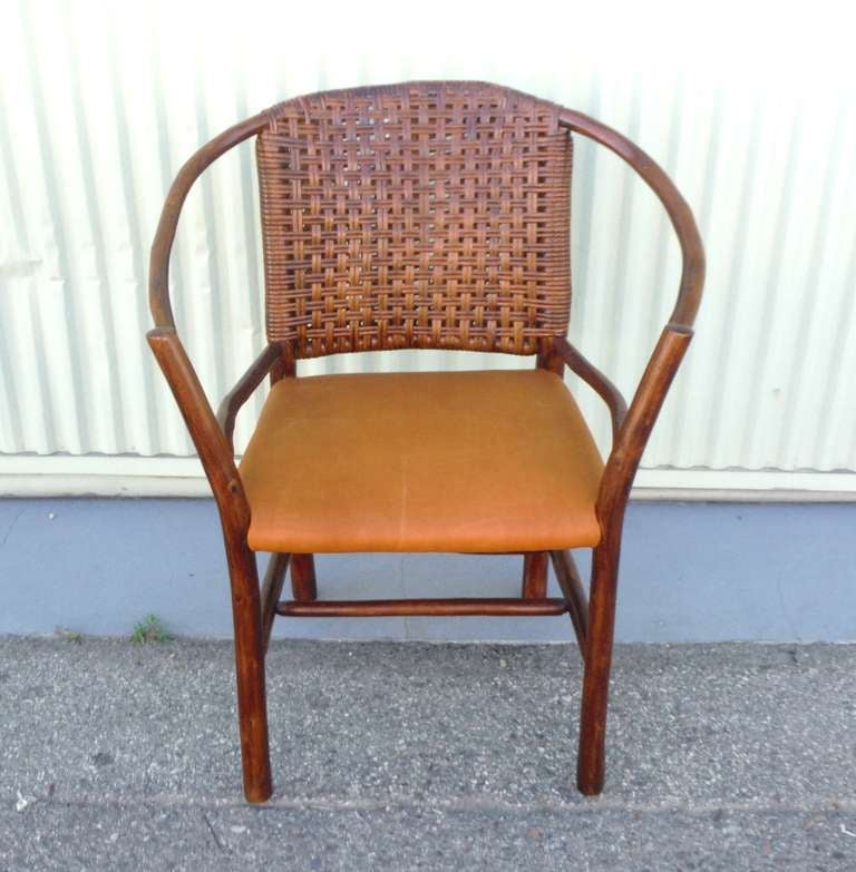 1930's Amazing old hickory barrel back side chair with the original woven backing . This comfortable chair works well in every room in the house . The seat is  upholstered in top quality cow hide leather . The condition is mint. The finish is a
