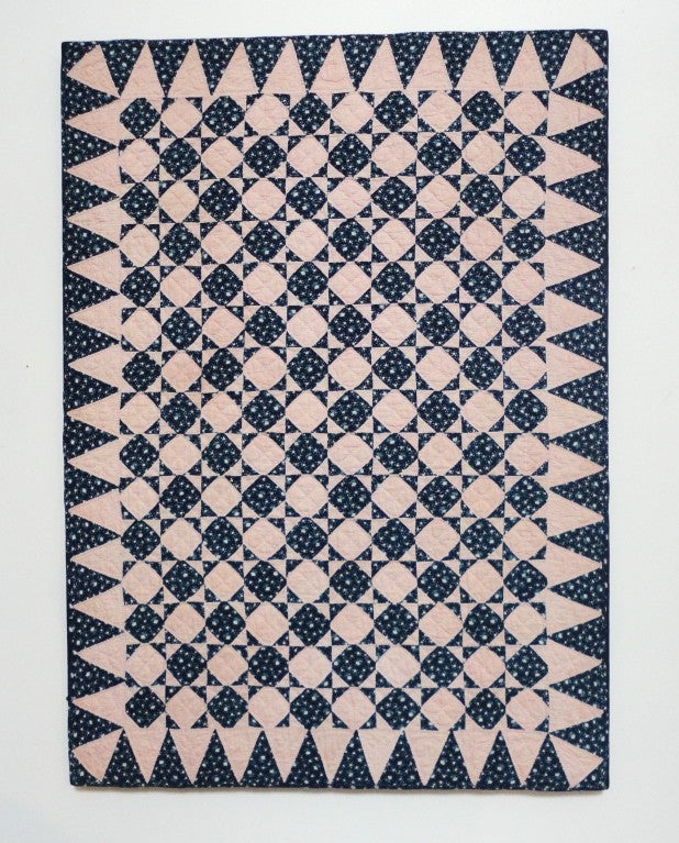 This early fantastic small pieced 19thc crib quilt is a combination of blue resist calico fabrics and light red & white calico fabrics from New England .This mini snow ball variation crib quilt has fantastic piecing and quilting with a wonderful