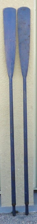 Wonderful Early original blue painted oars from the state of Maine.This wonderful pair of boat oars have the best patina and a crackle surface .Very hard to find in this color and surface.The condition is great.