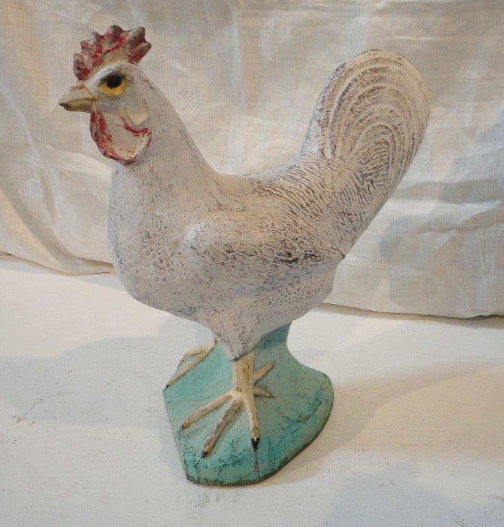 This wonderful folky and fun concrete roster from a farm in the mid west is in great condition.The paint is all original and has a mat finish.Minor wear on the base and around the rosters beak,to be expected with age.This wonderful garden ornament