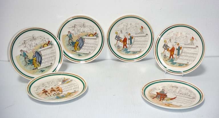 These six French Opera Plates are by Parry Vielle, Limoges and date to the turn of the century. The plates are whiteware (stoneware), measure 10 inches across and are banded in green with 18K gold trim. The plates are signed, numbered and depict