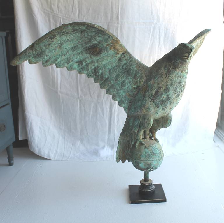 This large scale 19Th century has a wonderful untouched verdigris surface and unbelievable form. This vane is most likely a J.W. Fiske of NewYork maker. The top of the wingspan has the original iron rod or bar running from left to right of the