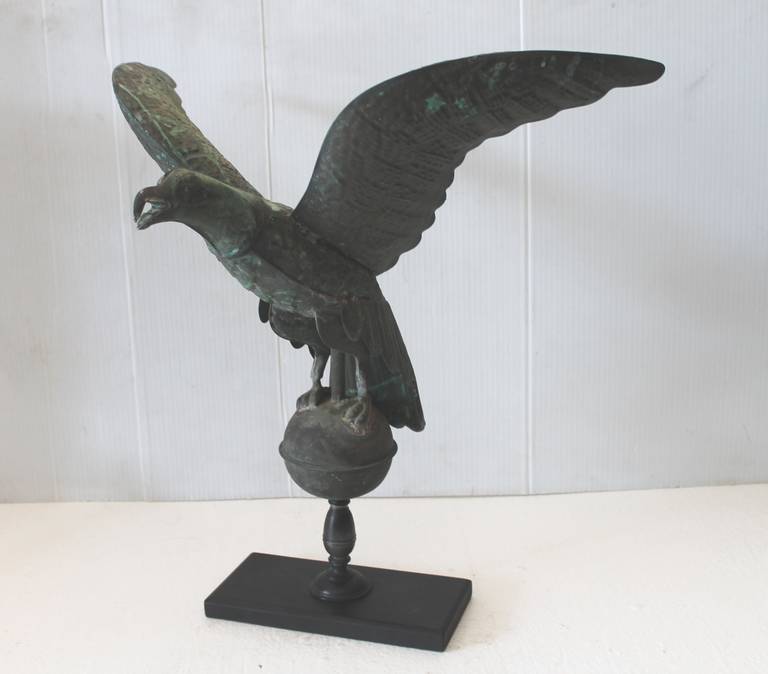 19th century full body eagle weather vane on wood mount or stand. This wonderful verdigris vane is in as found great condition. The eagle is a copper patined vane in wonderful condition.