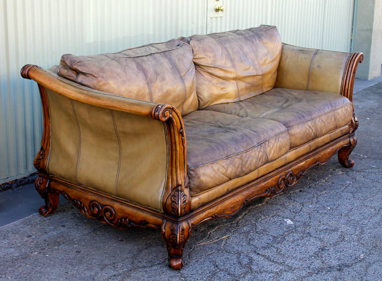 Monumental Distressed Leather and Carved Wood Sofa In Distressed Condition In Los Angeles, CA