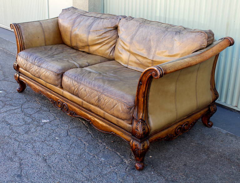 Mid-20th Century Monumental Distressed Leather and Carved Wood Sofa