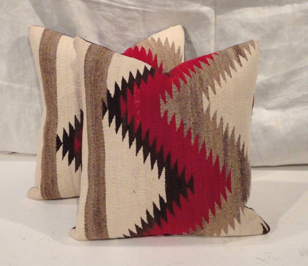 This wonderful eye dazzler Navajo weaving has such great geometric pattern and colors. The condition are very good and they have black linen backing.They are sold as a pair.