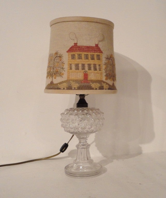 Early hobnail clear glass oil lamp converted to a electric desk lamp.This little gem is in great condition and has a wonderful handmade crewel  work shade that is from the early seventies.This was purchased in Pennsylvania in the seventies.The