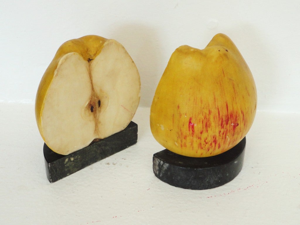 Early and quite unusual early handmade and painted large half apple bookends on marble bases.These fantastic pair of folky apples are all original paint and in great as found condition.The pair of bookends were found in Maine.The marble is a very