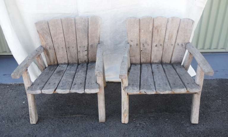 These charming vintage children's Adirondack chairs are from Cape Cod and were made in the early 1930's.  Heavy and sturdy, these chairs were hand constructed from pine and feature the original white washed paint.  A perfect addition to any seaside