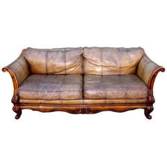 Used Monumental Distressed Leather and Carved Wood Sofa