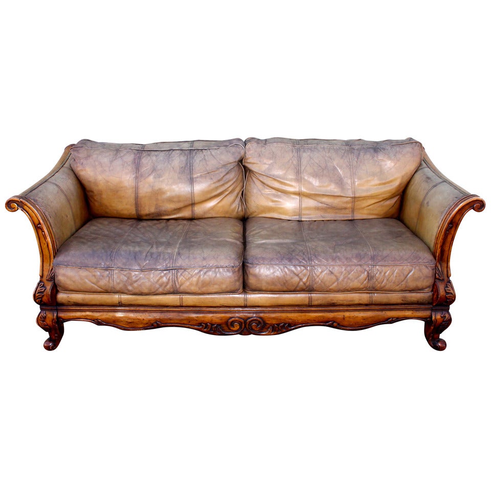 Monumental Distressed Leather and Carved Wood Sofa