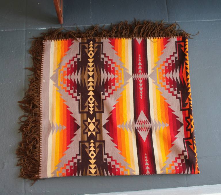 This is one of the great early Pendleton Indian design camp blankets.The condition is very good with minor tiny  moth bites in the wool edge but does not detract from the blanket.The original Cayuse label is there not not very readable.This is the
