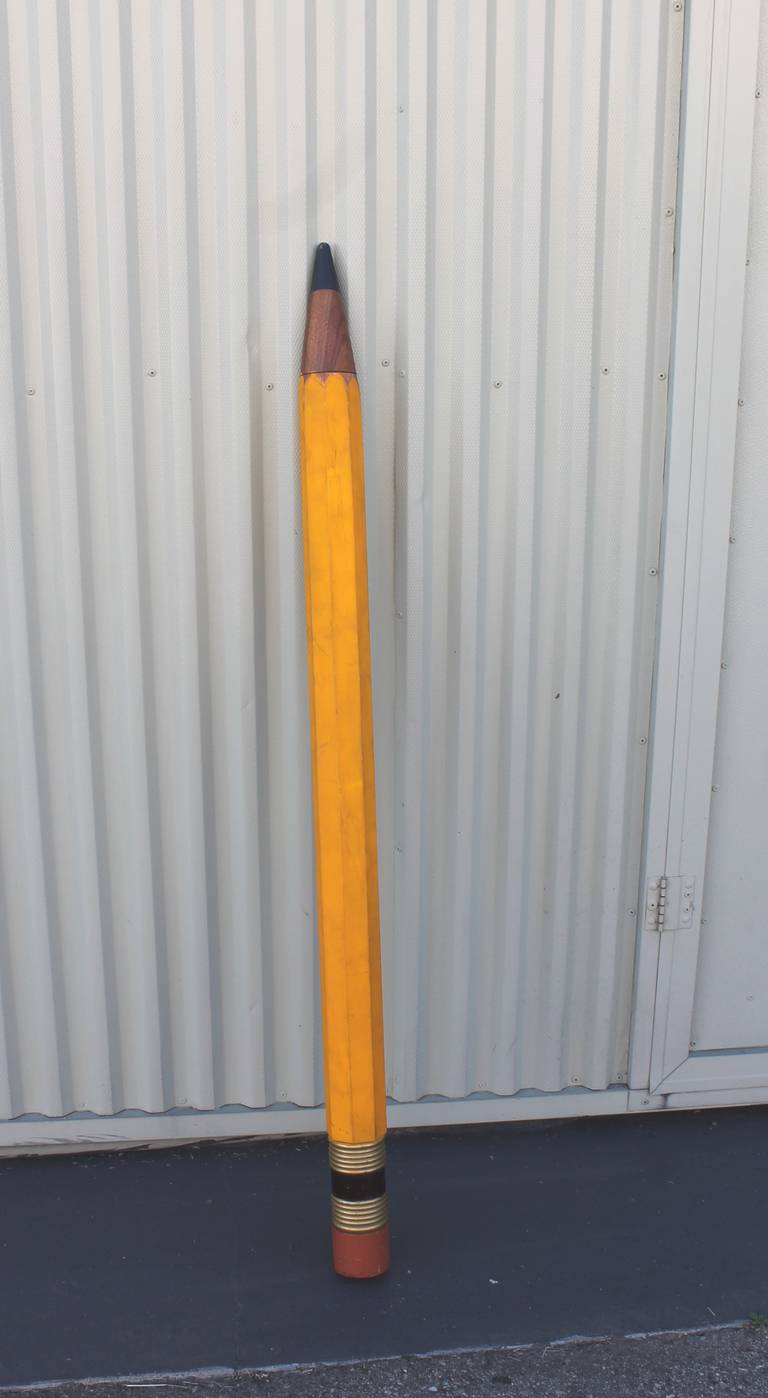 This giant pencil is all hand made with the original painted surface.Usually these type pencils have a advertisement on the side or end tip however this does not. This is done in one piece of wood with the end tips added to make three pieces of