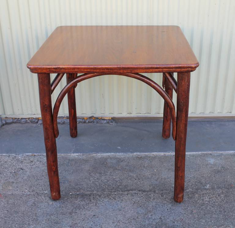 This Old Hickory table has a wonderful worn surface and super patina. The legs and base have a grungy old surface and retain a very beautiful untouched surface. The table fits almost all size hickory chairs if wanted to use as a gaming table or even