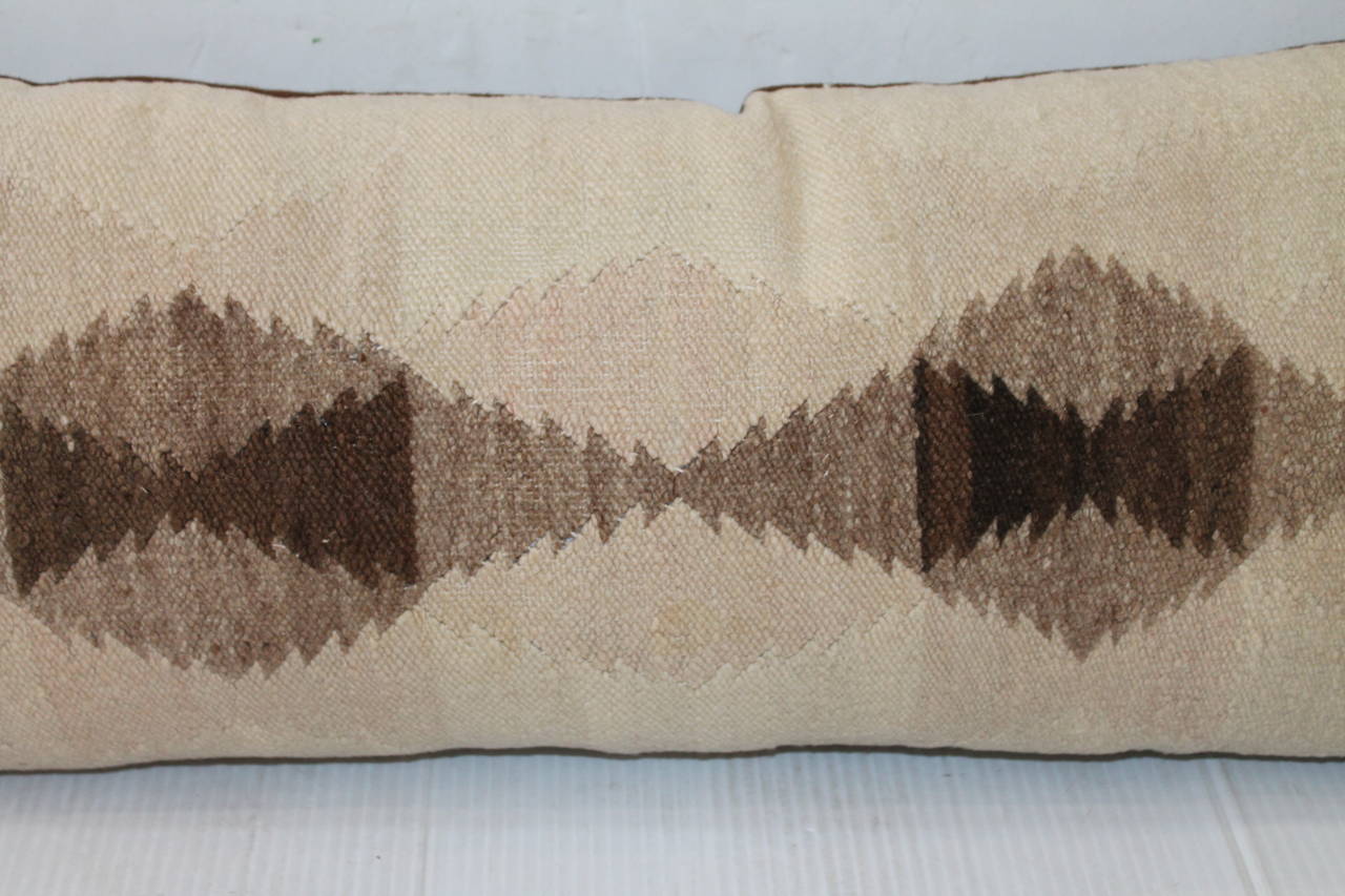 This is a somber Navajo weaving pattern in light colors and simple pattern. The condition is very good with a light brown cotton linen.