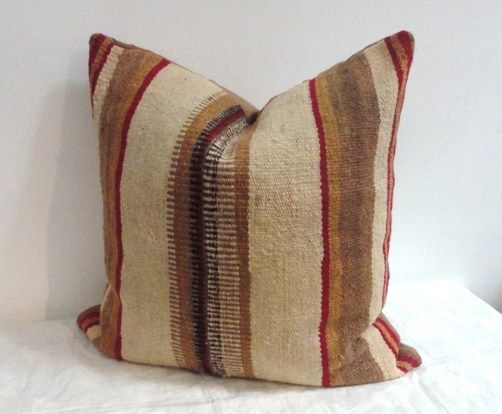 Fantastic colors in this early Indian  saddle blanket weaving pillow.The backing  is a tan cotton linen.Great condition.